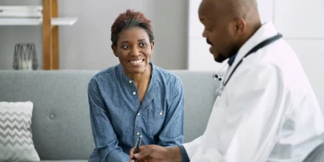 depositphotos_465372040-stock-photo-doctor-talking-elderly-african-patient